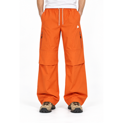 Cheviot men's orange trousers, waist-down studio view