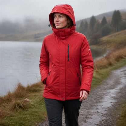 Woman wearing the Red Derwent jacket beside a wet British lake
