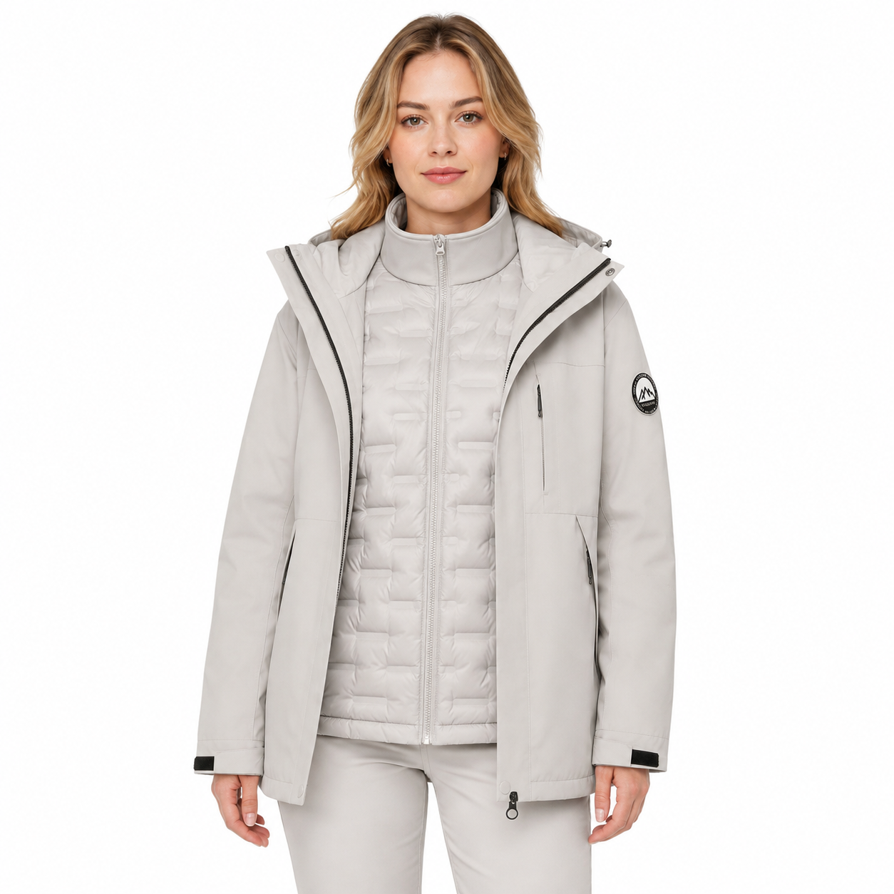 Woman wearing the Angular Core Ice Grey 3-in-1 jacket with the shell open and down liner zipped