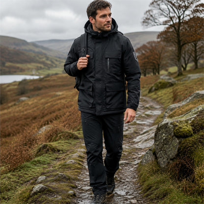 Man hiking in Britain wearing black Tamar 3-in-1 jacket